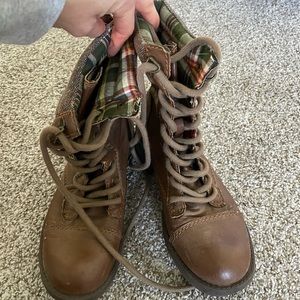 Brown laced up combat boots